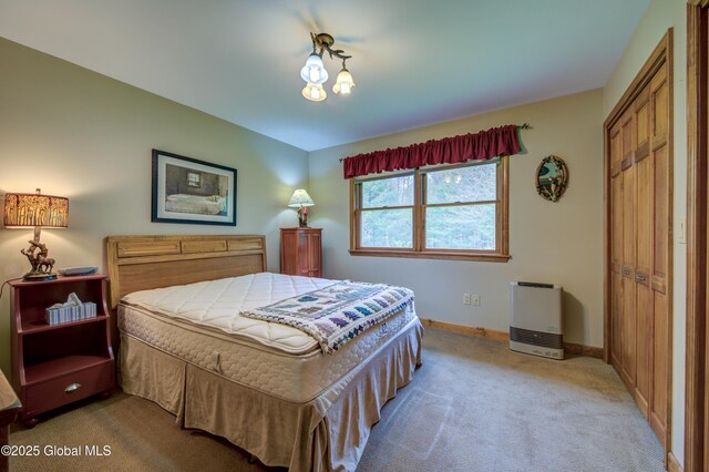 324 County Highway 112, Bleecker, NY 12078 - bedroom featuring light colored carpet, a closet, baseboards, and heating unit