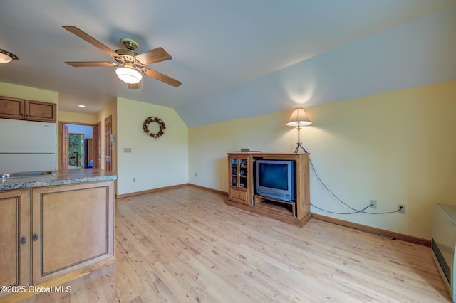 324 County Highway 112, Bleecker, NY 12078 - unfurnished living room with a ceiling fan, light wood-style flooring, vaulted ceiling, and baseboards