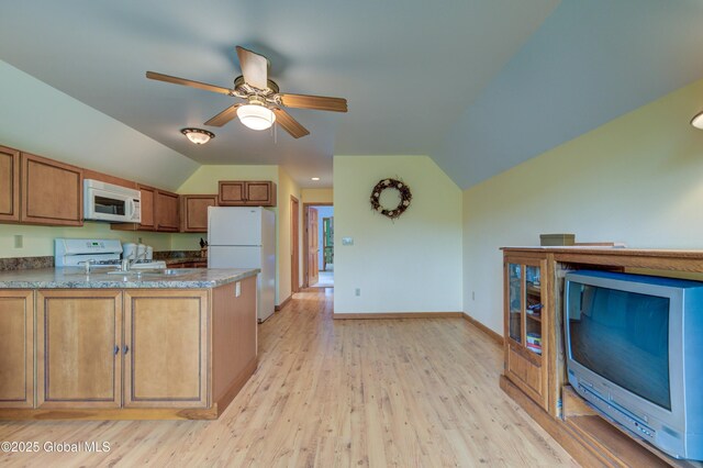 324 County Highway 112, Bleecker, NY 12078 - kitchen featuring white appliances, vaulted ceiling, brown cabinets, a ceiling fan, and light wood-style flooring