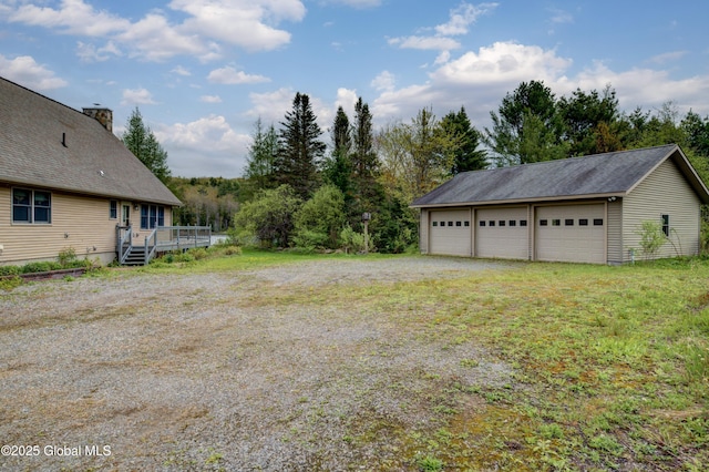 324 County Highway 112, Bleecker, NY 12078 - view of yard with a detached garage, a wooden deck, and an outbuilding