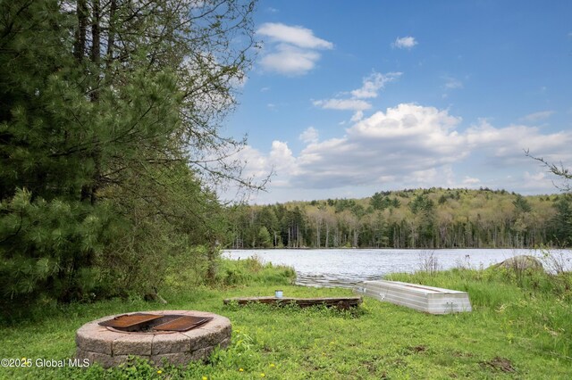 324 County Highway 112, Bleecker, NY 12078 - view of yard featuring a wooded view, a fire pit, and a water view