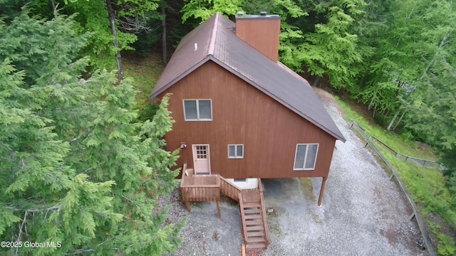 441 E Kelm Pond Rd, Warrensburg, NY 12885 - view of home's exterior featuring stairs and a chimney