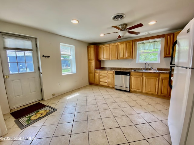 6963 Fuller Station Rd, Schenectady, NY 12303 - kitchen with freestanding refrigerator, dishwasher, a sink, plenty of natural light, and recessed lighting