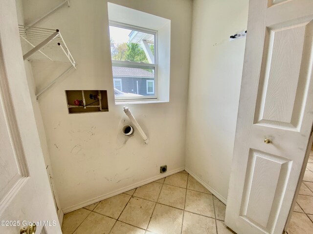 6963 Fuller Station Rd, Schenectady, NY 12303 - clothes washing area featuring washer hookup, light tile patterned floors, baseboards, and electric dryer hookup