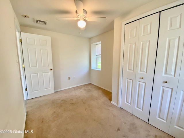 6963 Fuller Station Rd, Schenectady, NY 12303 - unfurnished bedroom featuring a closet, light carpet, baseboards, and a ceiling fan