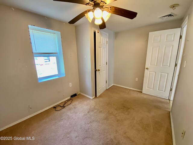 6963 Fuller Station Rd, Schenectady, NY 12303 - unfurnished bedroom with carpet floors, baseboards, and a ceiling fan