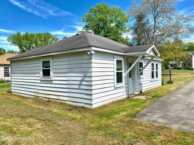6963 Fuller Station Rd, Schenectady, NY 12303 - view of home's exterior featuring a yard and a shingled roof