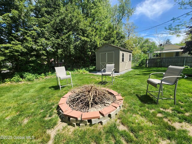 1 Laurel Rd, Moreau, NY 12828 - view of yard with an outdoor fire pit, a shed, and an outbuilding