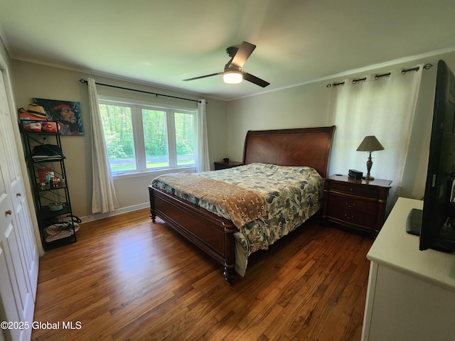 1 Laurel Rd, Moreau, NY 12828 - bedroom featuring dark wood-style floors, crown molding, baseboards, and a ceiling fan