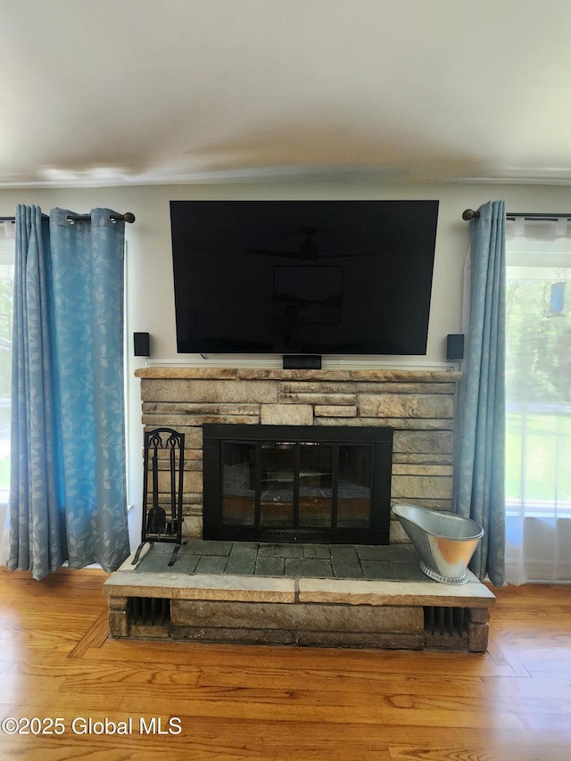 1 Laurel Rd, Moreau, NY 12828 - detailed view of a stone fireplace and wood finished floors