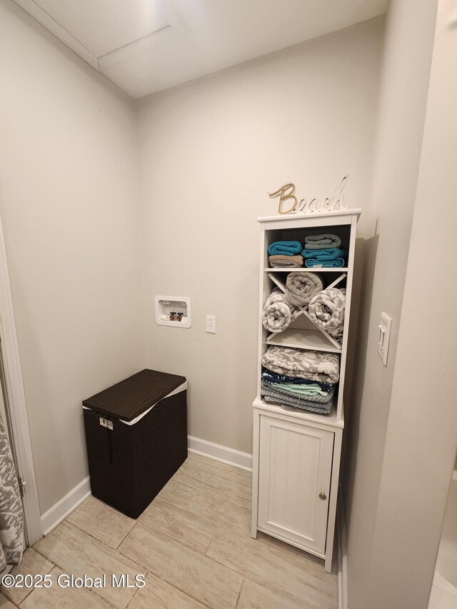1 Laurel Rd, Moreau, NY 12828 - laundry area featuring light wood finished floors, hookup for a washing machine, and baseboards