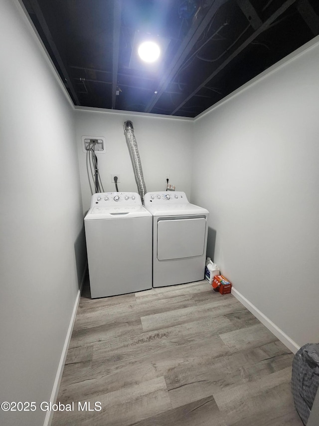 1 Laurel Rd, Moreau, NY 12828 - washroom with separate washer and dryer, wood finished floors, and baseboards