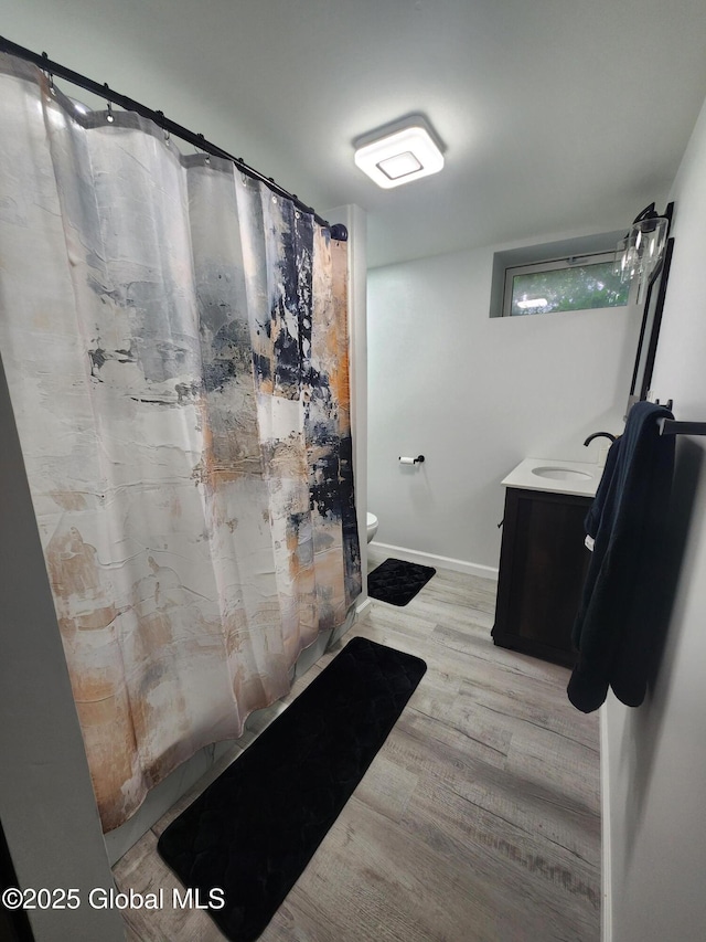 1 Laurel Rd, Moreau, NY 12828 - full bath featuring wood finished floors, toilet, curtained shower, and vanity