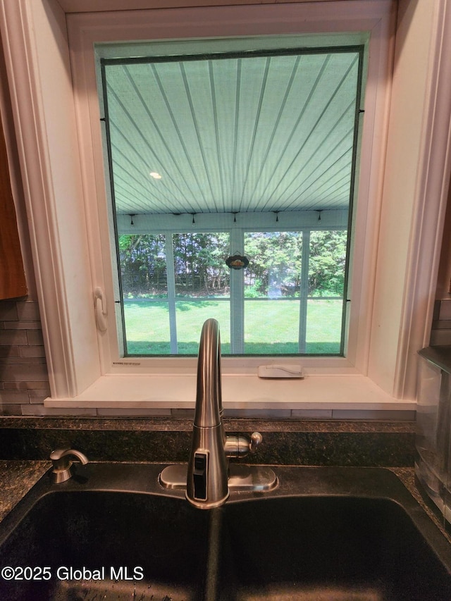 1 Laurel Rd, Moreau, NY 12828 - kitchen view of a sink, backsplash, and dark countertops