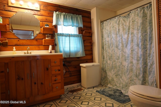 40 W Starbuck Ln, Fort Ann, NY 12827 - bathroom with rustic walls, toilet, vanity, curtained shower, and tile patterned floors