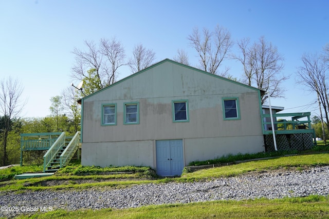 40 W Starbuck Ln, Fort Ann, NY 12827 - view of side of home featuring a deck and stairway