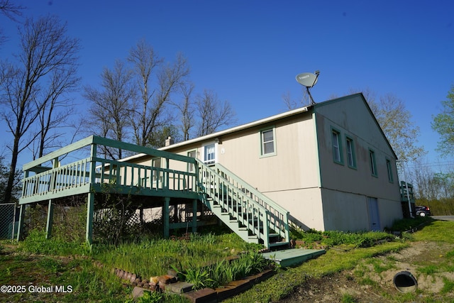 40 W Starbuck Ln, Fort Ann, NY 12827 - back of house featuring a wooden deck and stairway
