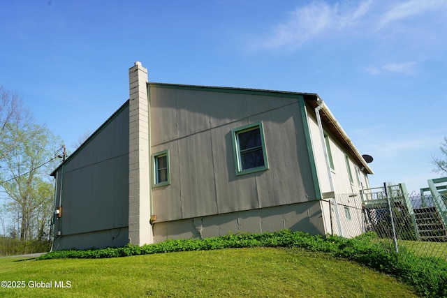 40 W Starbuck Ln, Fort Ann, NY 12827 - view of property exterior with a chimney