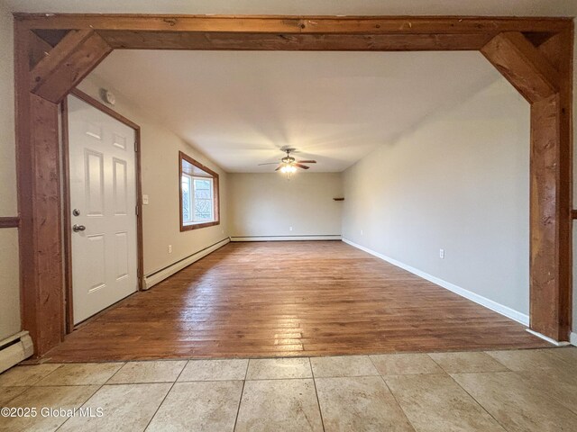 3 Schuyler Ave, Ravena, NY 12143 - unfurnished room featuring ceiling fan, baseboard heating, and light wood-type flooring
