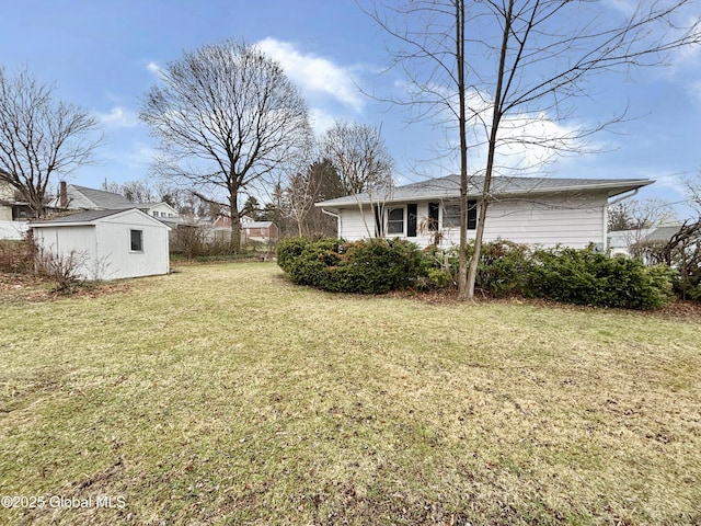3 Schuyler Ave, Ravena, NY 12143 - view of green lawn featuring an outdoor structure and a storage shed