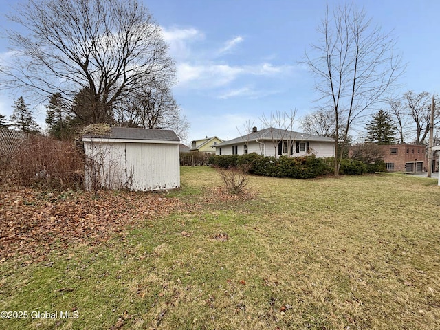 3 Schuyler Ave, Ravena, NY 12143 - view of grassy yard featuring a storage unit and an outbuilding