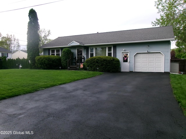 view of front of property with a garage, driveway, and a front lawn
