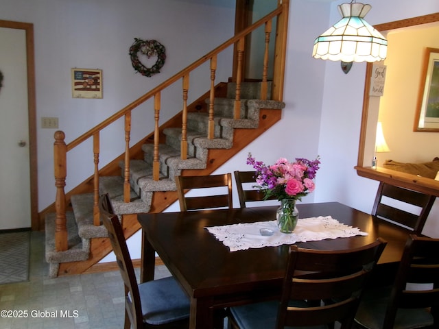 dining room with stairway