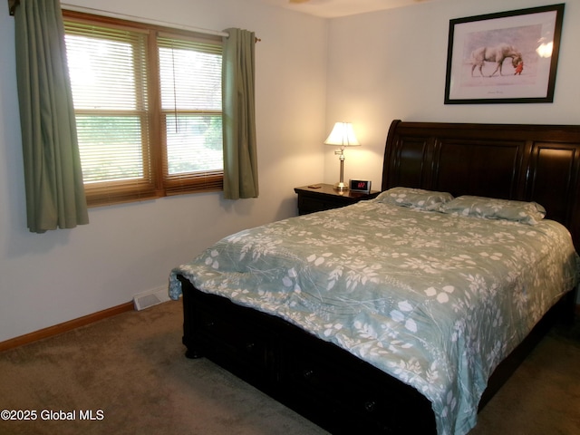 bedroom with carpet and baseboards