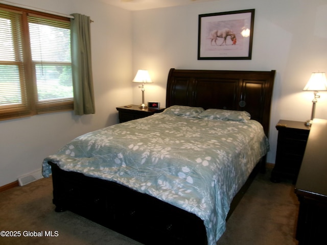 carpeted bedroom featuring baseboards