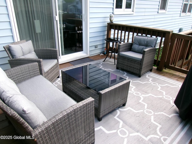 wooden terrace featuring an outdoor hangout area