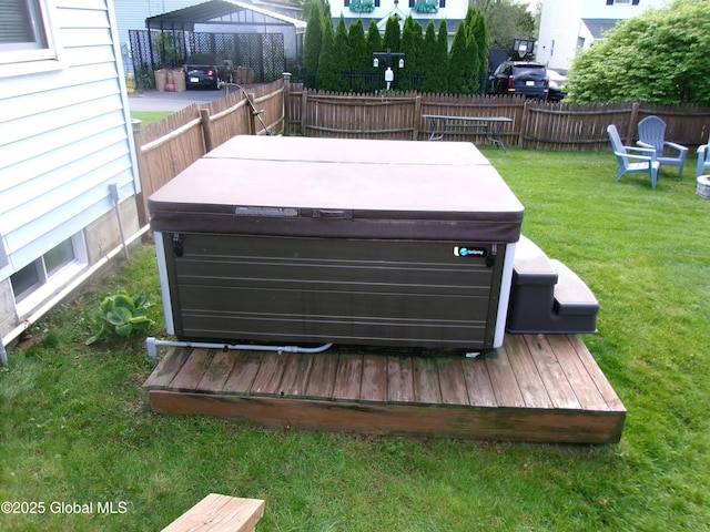 exterior view of a jacuzzi and fence
