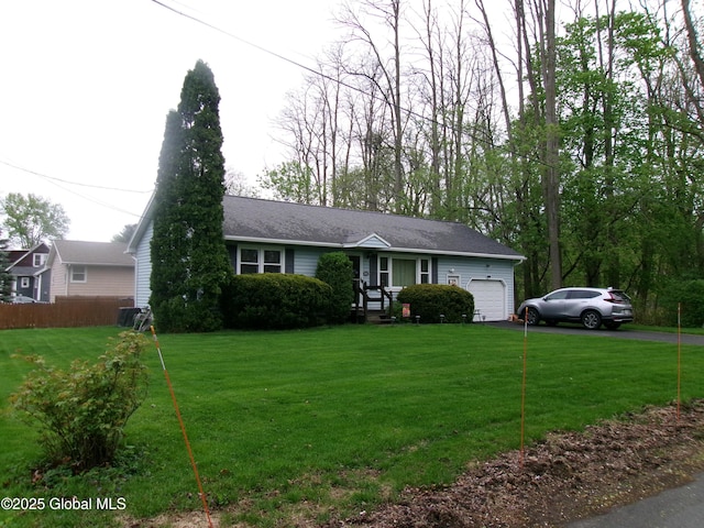 view of front facade with a garage and asphalt driveway