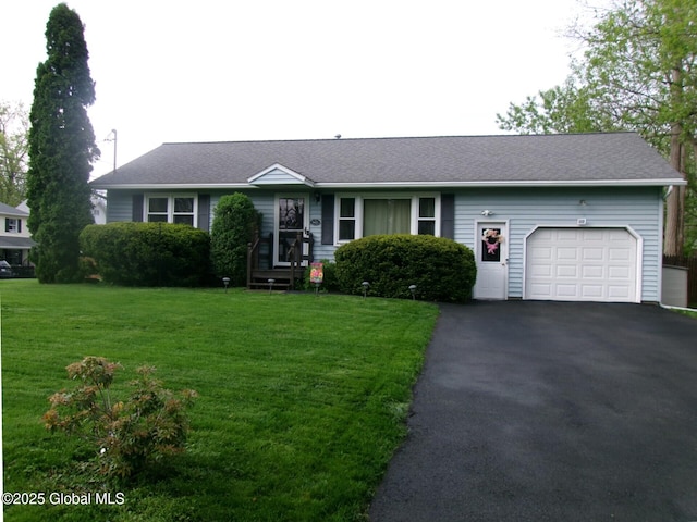 view of front of house with a garage, asphalt driveway, a front yard, and a shingled roof