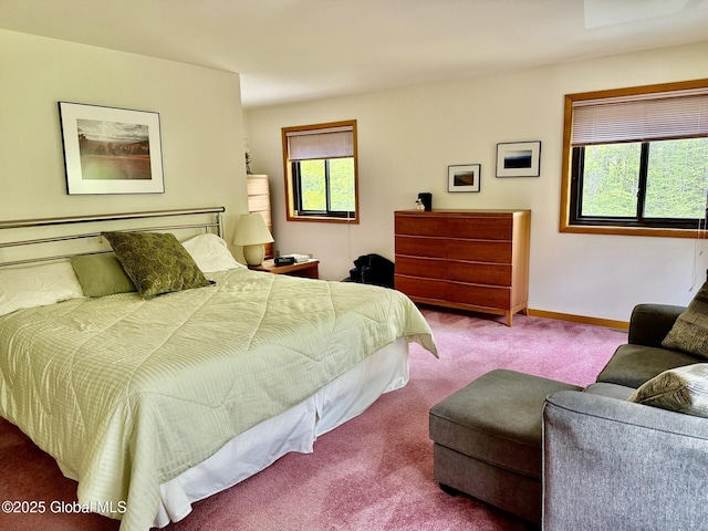 carpeted bedroom with baseboards