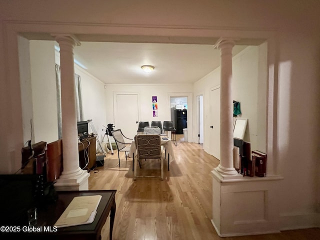 327 9th St, Troy, NY 12180 - dining area featuring decorative columns and light wood-type flooring