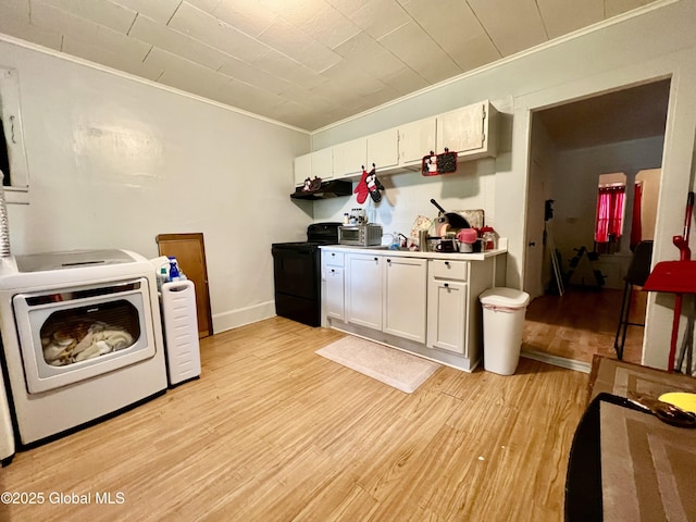 327 9th St, Troy, NY 12180 - laundry area with washer / dryer, crown molding, light wood-style flooring, and baseboards