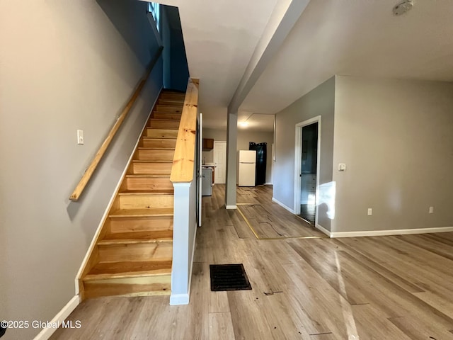 254 2nd St, Albany, NY 12206 - stairs with wood finished floors and baseboards