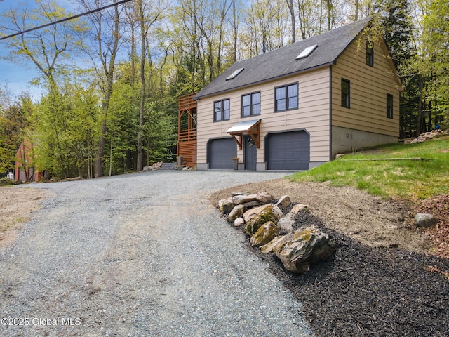 view of home's exterior featuring driveway and an attached garage
