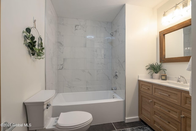 bathroom featuring toilet, vanity,  shower combination, and tile patterned floors