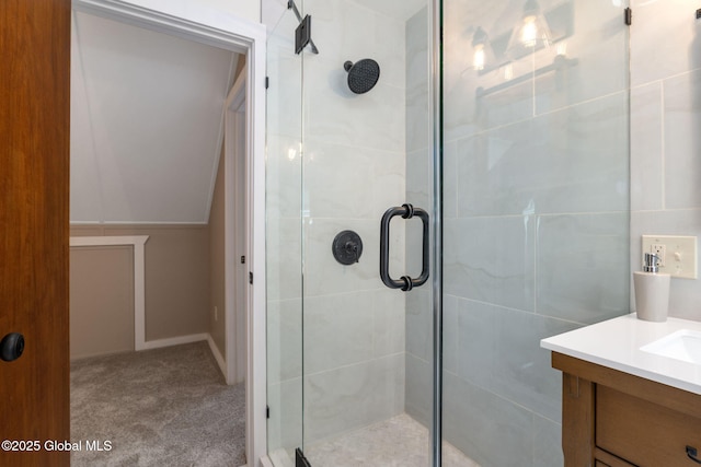 full bathroom featuring a stall shower and vanity