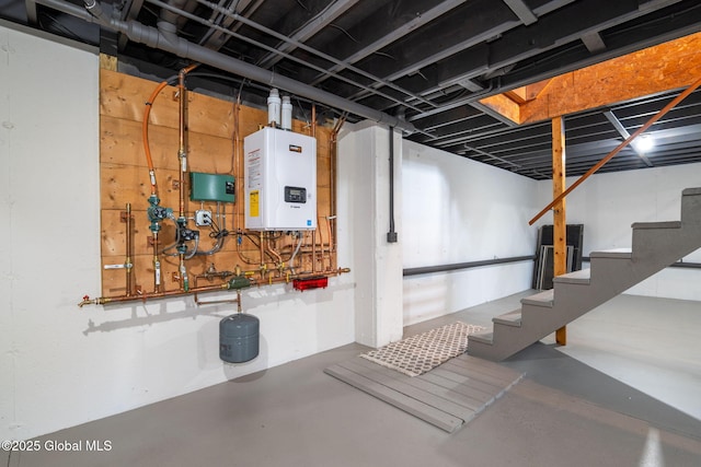 below grade area with tankless water heater and stairs