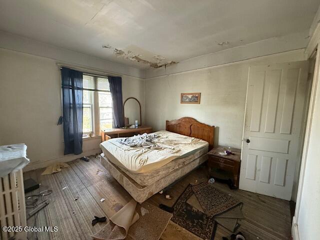 bedroom featuring wood finished floors