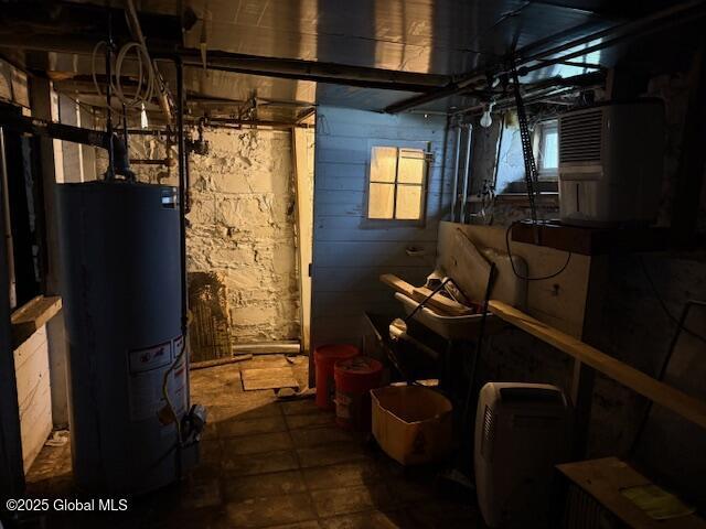 utility room with water heater