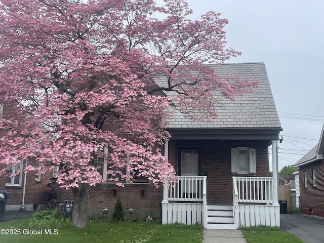 130 Van Schoick Ave, Albany, NY 12209 - view of front of property featuring covered porch and brick siding