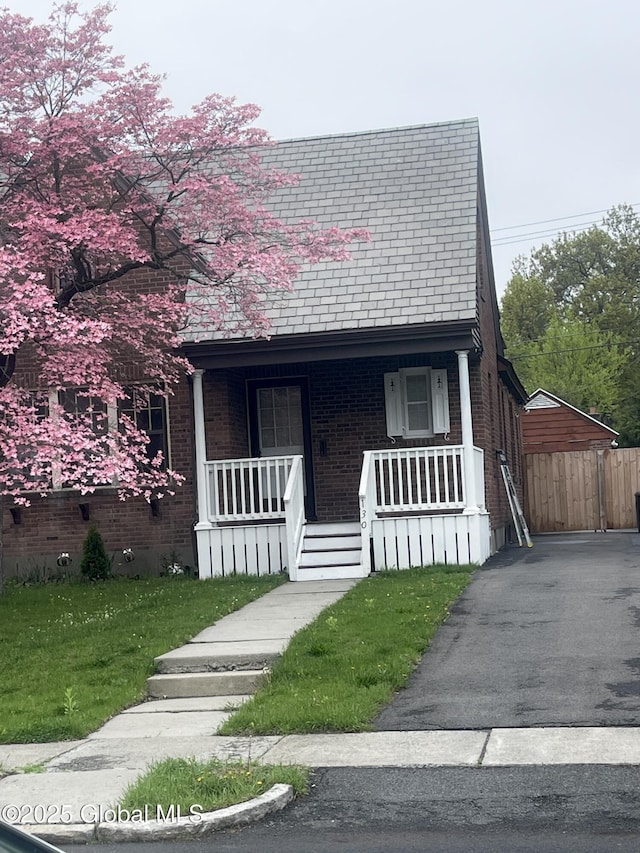 130 Van Schoick Ave, Albany, NY 12209 - view of front of home featuring a porch and brick siding