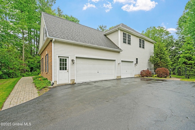6004 Queen Mary Ct, Schenectady, NY 12303 - view of home's exterior with driveway, roof with shingles, and a garage