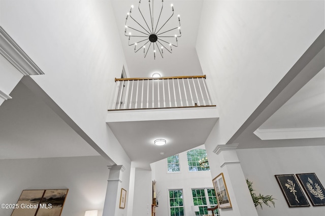 6004 Queen Mary Ct, Schenectady, NY 12303 - stairway featuring a towering ceiling, ornate columns, and a chandelier