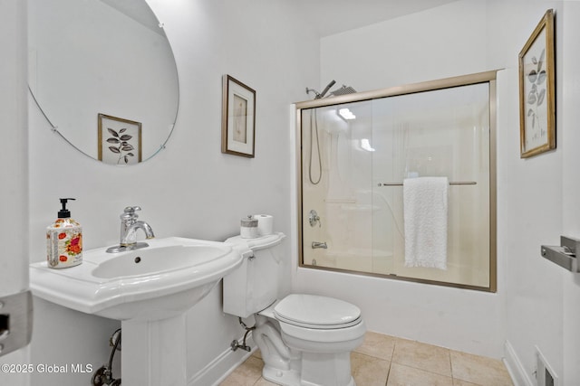 6004 Queen Mary Ct, Schenectady, NY 12303 - bathroom with toilet, combined bath / shower with glass door, tile patterned floors, and baseboards