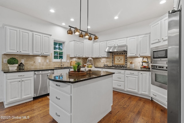6004 Queen Mary Ct, Schenectady, NY 12303 - kitchen featuring stainless steel appliances, a sink, a kitchen island, white cabinets, and recessed lighting