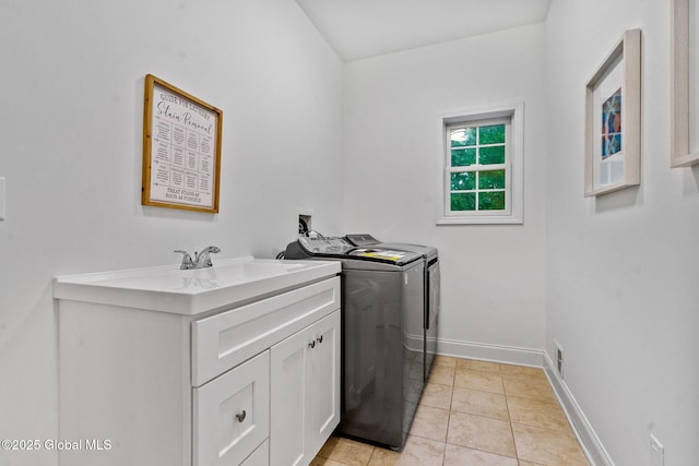 6004 Queen Mary Ct, Schenectady, NY 12303 - washroom with independent washer and dryer, cabinet space, baseboards, and light tile patterned floors